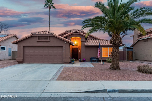 mediterranean / spanish-style home featuring a garage