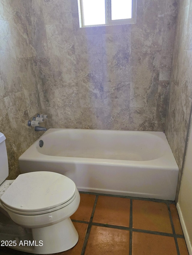 bathroom with tile patterned flooring and toilet