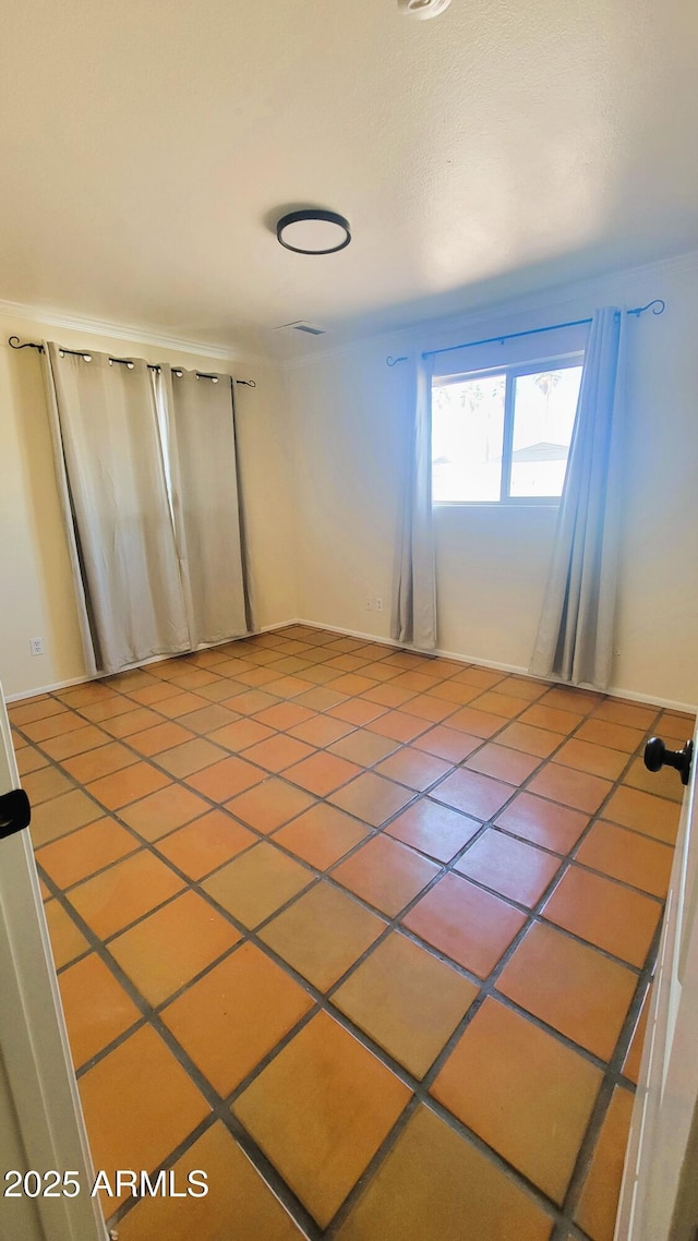 spare room with tile patterned floors