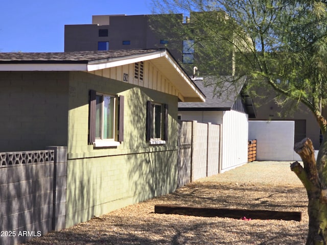 view of home's exterior featuring fence