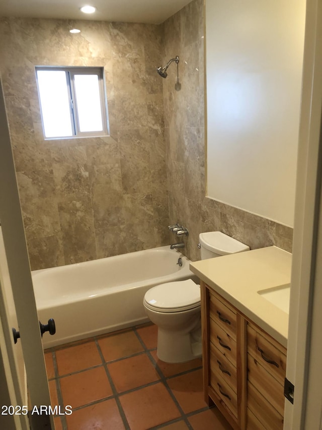 full bath featuring toilet, vanity, tub / shower combination, and tile patterned floors