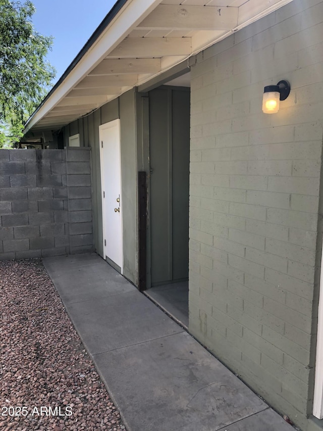 doorway to property with fence