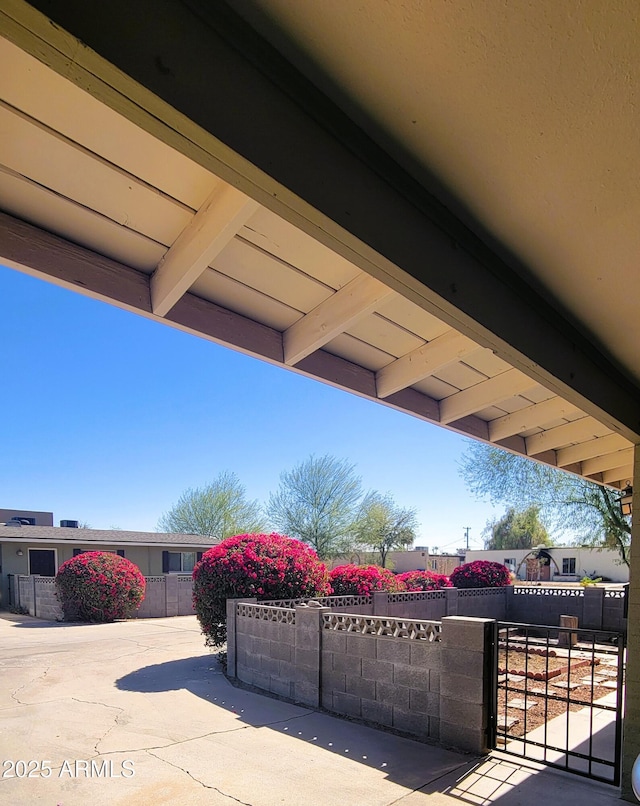 details featuring a fenced front yard and a gate