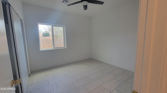 unfurnished room with ceiling fan