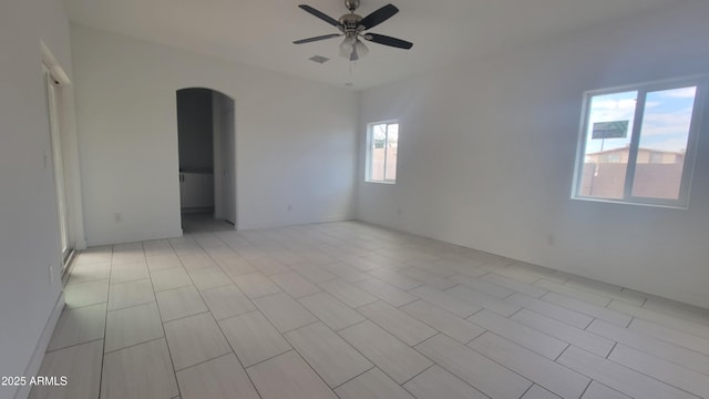 unfurnished room featuring ceiling fan