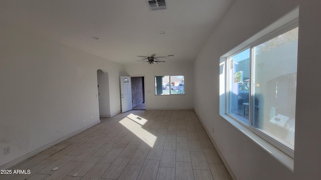 empty room with light wood-type flooring and ceiling fan