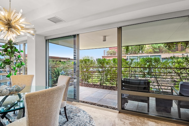 interior space featuring a notable chandelier and a wealth of natural light