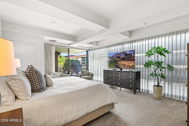 carpeted bedroom featuring beamed ceiling