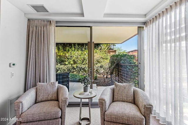 living area featuring carpet