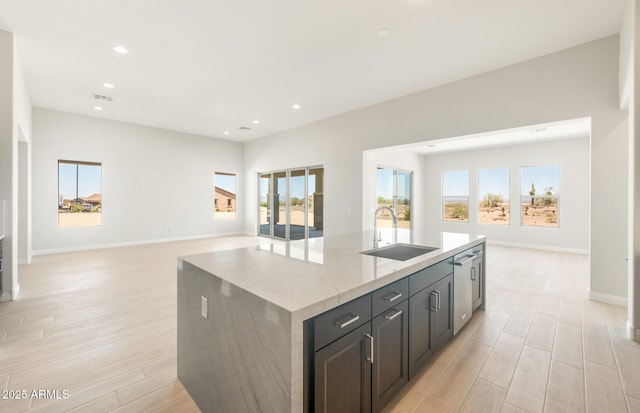 18716 N 269th Ln, Buckeye, AZ 85396 - kitchen with a sink, open floor plan, light wood-style floors, healthy amount of natural light, and recessed lighting