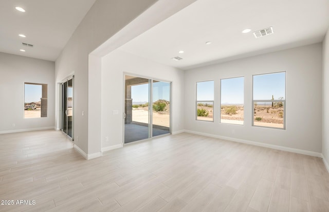 18716 N 269th Ln, Buckeye, AZ 85396 - empty room featuring recessed lighting, light wood-style floors, and baseboards