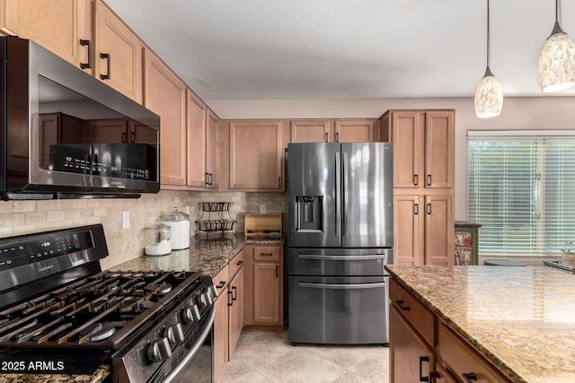 kitchen with appliances with stainless steel finishes, stone counters, decorative light fixtures, and backsplash