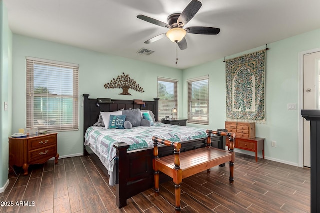 bedroom featuring ceiling fan, wood finish floors, visible vents, and baseboards