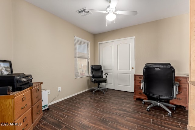 office space featuring baseboards, wood finish floors, visible vents, and a ceiling fan