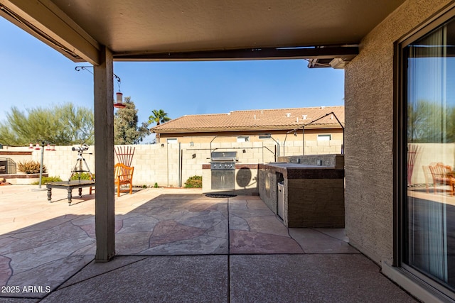 view of patio / terrace featuring a fenced backyard and area for grilling