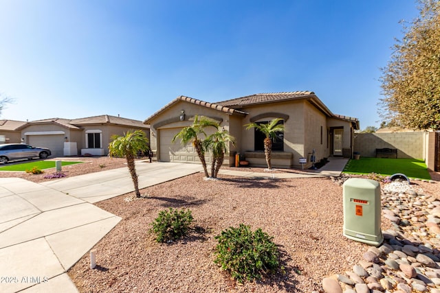 view of front facade with stucco siding, concrete driveway, fence, a garage, and a tiled roof