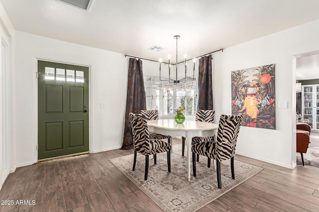 430 N Vineyard, Mesa, AZ 85201 - dining space featuring an inviting chandelier, baseboards, dark wood finished floors, and visible vents