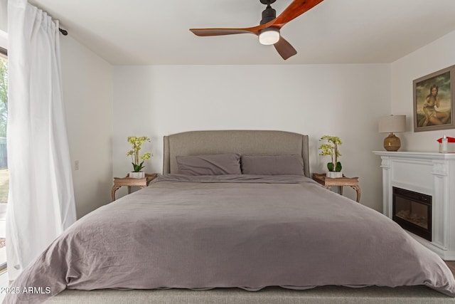 430 N Vineyard, Mesa, AZ 85201 - bedroom with a glass covered fireplace and ceiling fan
