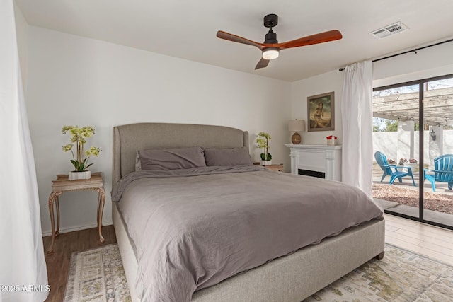 430 N Vineyard, Mesa, AZ 85201 - bedroom featuring access to outside, a ceiling fan, visible vents, and light wood-style flooring