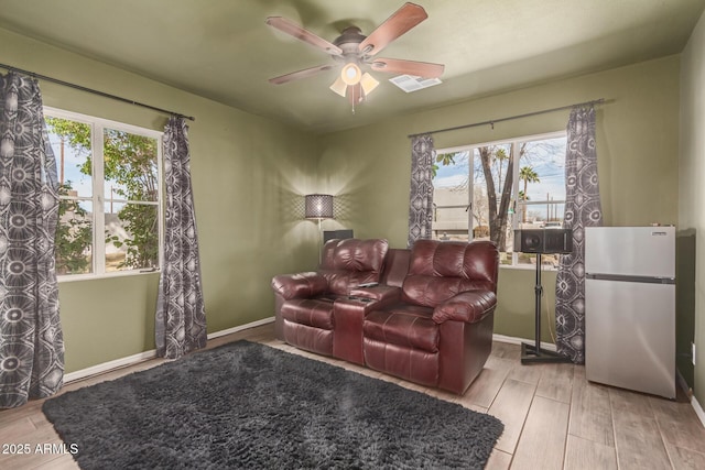 430 N Vineyard, Mesa, AZ 85201 - living area with baseboards, ceiling fan, visible vents, and wood finished floors