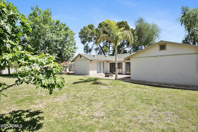 430 N Vineyard, Mesa, AZ 85201 - rear view of house featuring a lawn, a patio, stucco siding, and central AC unit