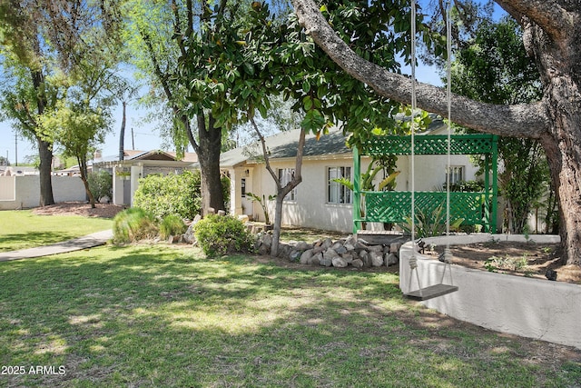 430 N Vineyard, Mesa, AZ 85201 - view of side of property with stucco siding, a yard, and fence