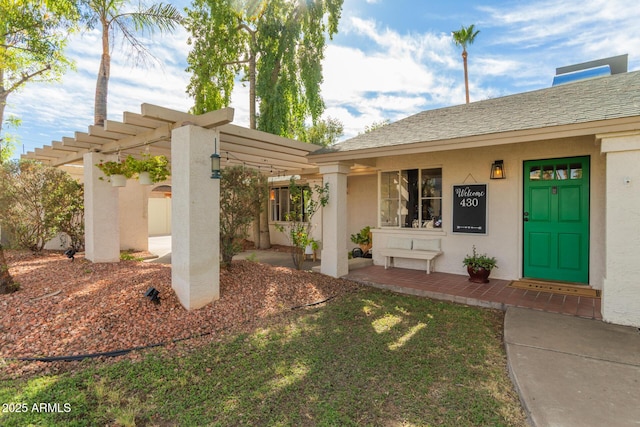 430 N Vineyard, Mesa, AZ 85201 - view of exterior entry with stucco siding and a pergola