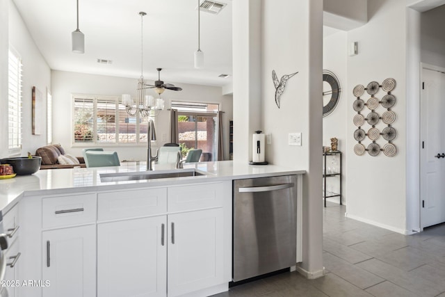 kitchen with a sink, light countertops, visible vents, and stainless steel dishwasher