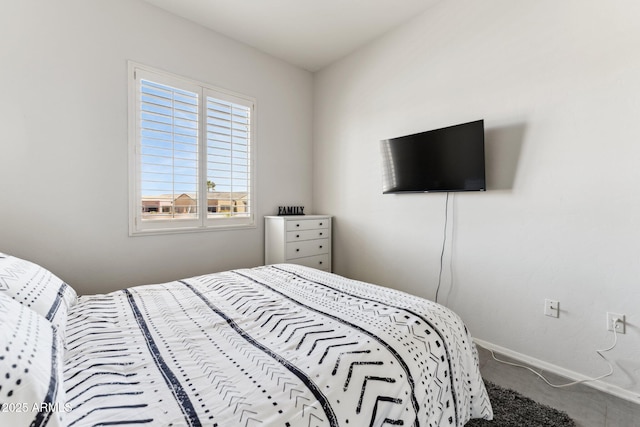 carpeted bedroom with baseboards