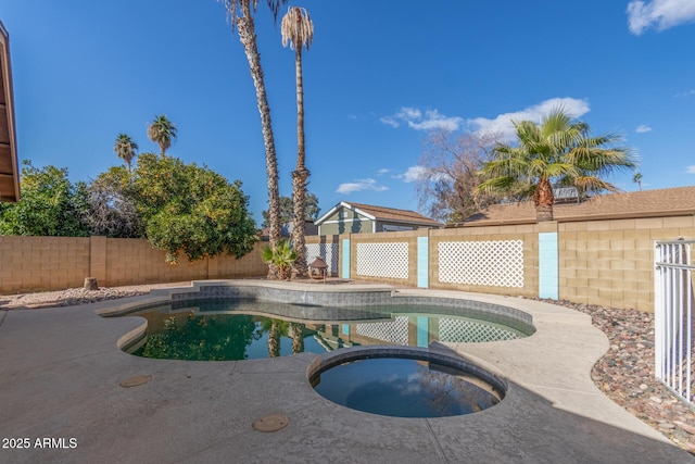 view of pool with an in ground hot tub