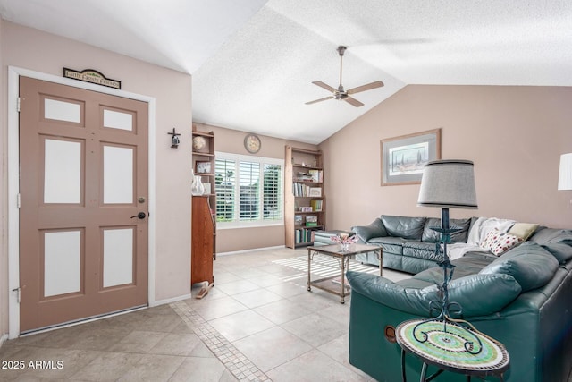 tiled living room with ceiling fan and lofted ceiling