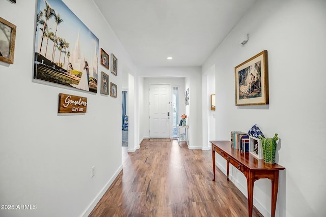 hallway with wood-type flooring