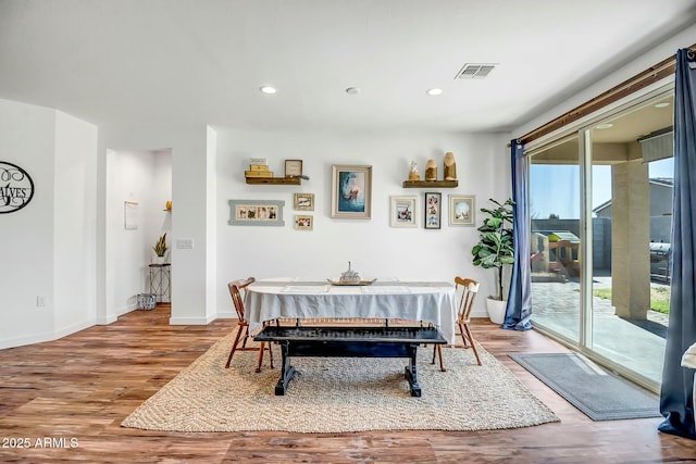 dining area featuring hardwood / wood-style flooring