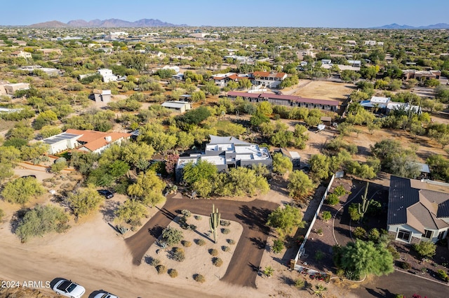 birds eye view of property with a mountain view