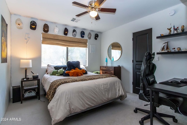 bedroom featuring light carpet and ceiling fan