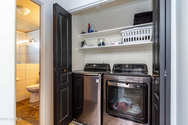 laundry area with washing machine and dryer