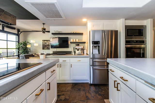 kitchen featuring white cabinetry, ceiling fan, and appliances with stainless steel finishes