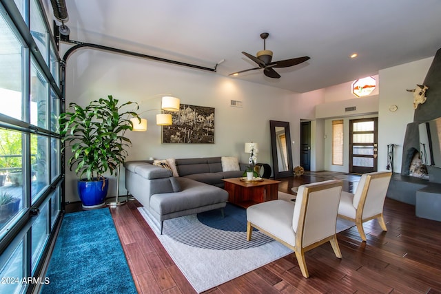 living room featuring plenty of natural light, dark hardwood / wood-style floors, and ceiling fan