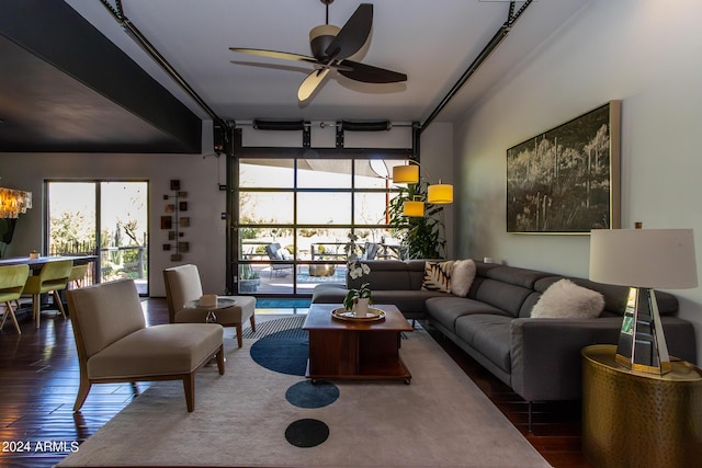 living room with dark hardwood / wood-style floors and ceiling fan