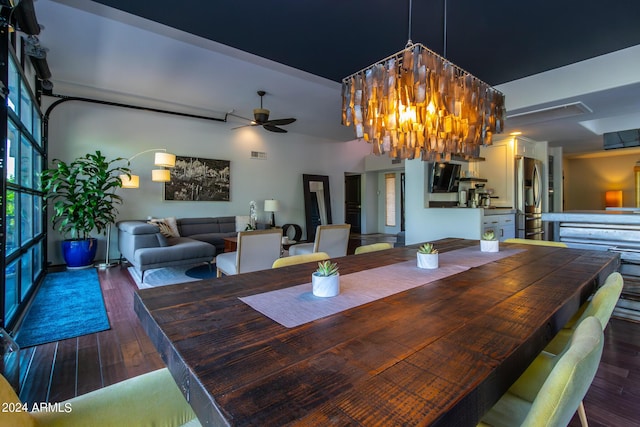 dining room with ceiling fan and dark hardwood / wood-style flooring