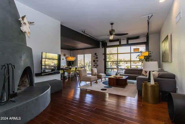 living room featuring hardwood / wood-style flooring and ceiling fan