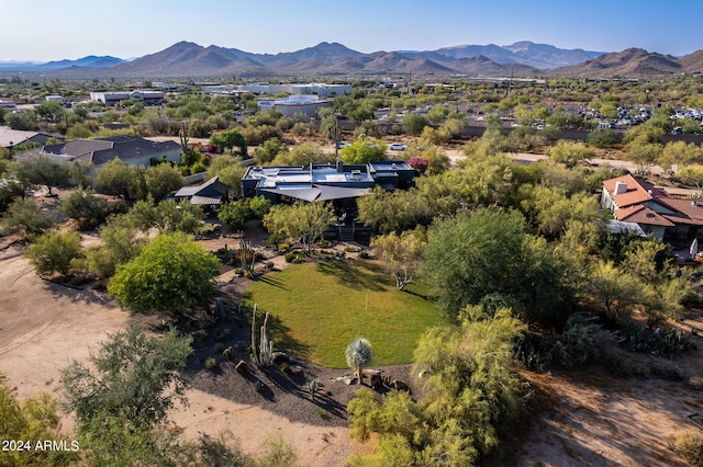 birds eye view of property with a mountain view