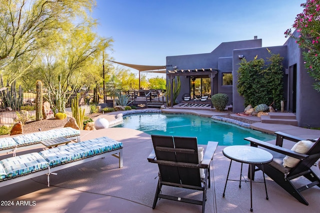 view of swimming pool with a patio area