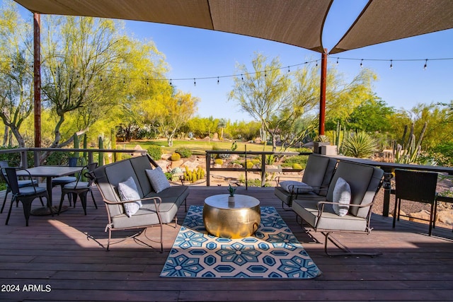 wooden terrace featuring outdoor lounge area