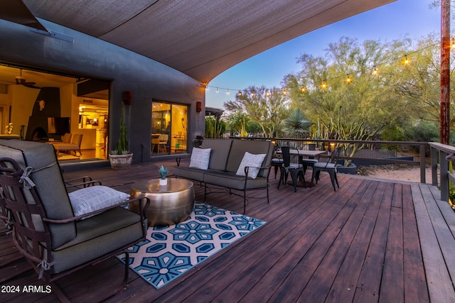 wooden terrace featuring outdoor lounge area