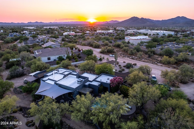 aerial view at dusk with a mountain view