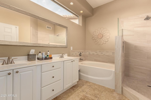 bathroom with vanity, tile patterned floors, and independent shower and bath