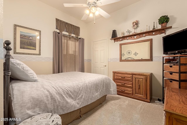 bedroom with ceiling fan and light colored carpet