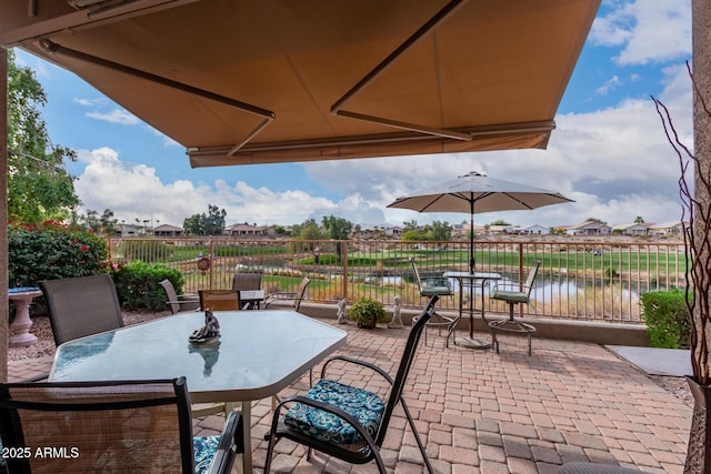 view of patio / terrace with a water view