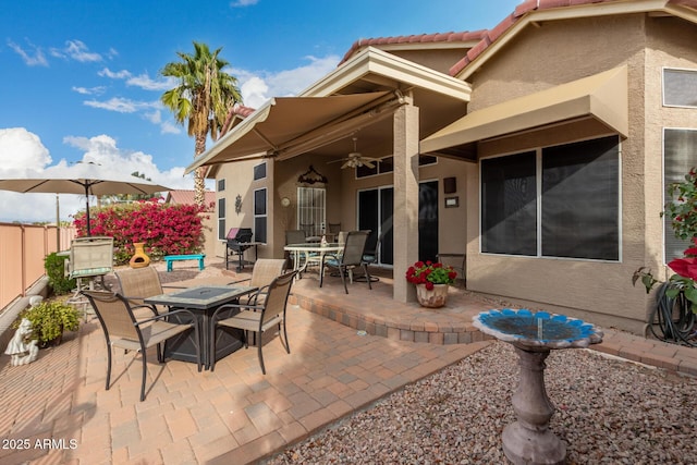 view of patio featuring ceiling fan